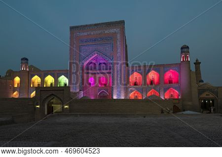 Khiva, Uzbekistan - September 07, 2022: Allakuli Khan Madrasah In Colorful Night Illumination At Eve