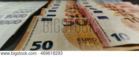 View Of Czech And Euro Banknotes Stacked On Top Of Each Other, Dark Background, Detail Of Euro Bankn
