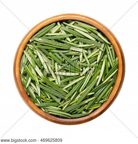 Fresh Rosemary Leaves, In A Wooden Bowl. Salvia Rosmarinus, An Aromatic And Evergreen Shrub, With Fr