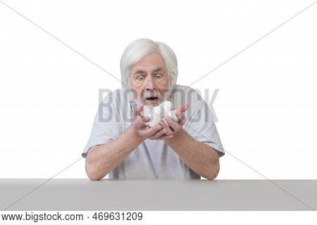 White-haired Old Man Is Astonished At Handful Of Eggs