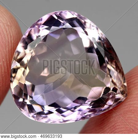 Natural Gemstone Bicolor Ametrine On A Gray Background