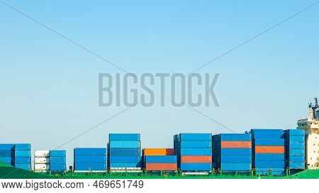 A Large Cargo Container Ship Loaded With Containers Against The Blue Sky And Empty Space