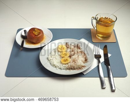 Lunch For A Person On The Brat Diet. White Rice, Bananas, Baked Apple And Chamomile Tea. View Of The
