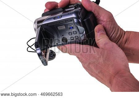 Close-up View Of Man's Hands Holding Jvc Video Camera Isolated On White Background. Sweden Uppsala. 