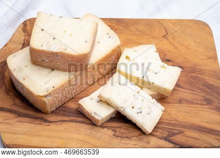 Italian Cheese Collection, Yellow Taleggio Cheese With Black Truffles Mushrooms