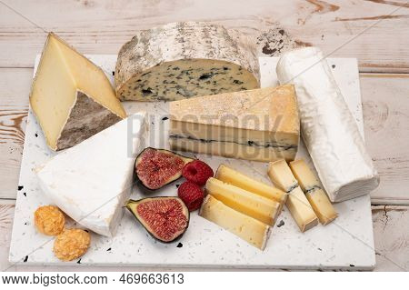 Cheese Collection, Marble Board With French Cheeses Brie, Tomme, Matured Goat Cheese, Morbier  Serve