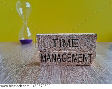 Сoncept For Time Management. Brick Blocks And Hourglass On Beautiful Yellow Background. Business Con