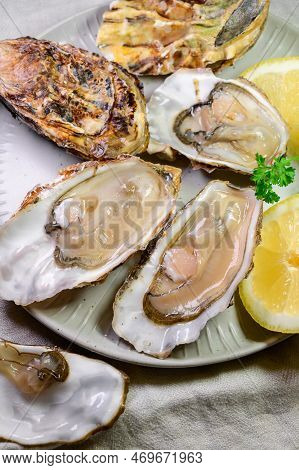 Eating Of Fresh Big Raw Zeeuwse Creuse Dutch Oysters From Zeeland, Netherlands