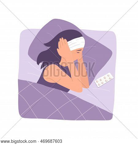 A Woman In Bed Suffers From A Headache