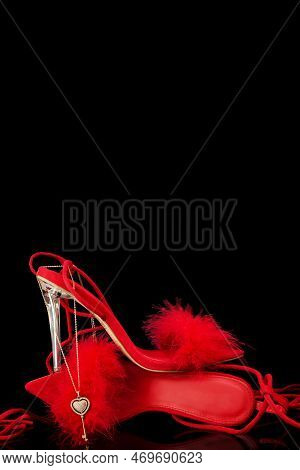 Sexy, Red Strappy High Heel Shoes With Box On A Black Background