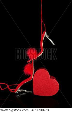 Sexy, Red Strappy High Heel Shoes With Box On A Black Background