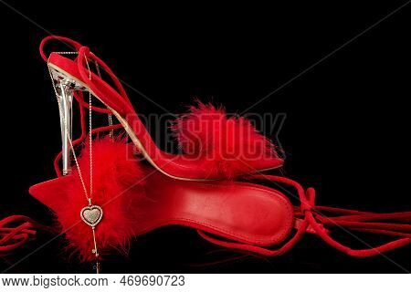 Sexy, Red Strappy High Heel Shoes With Box On A Black Background
