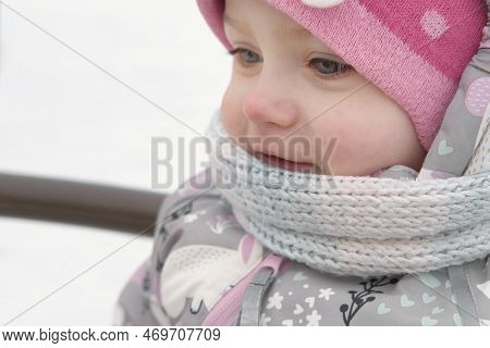 Happy Kid Having Fun On Carousel. Front View Of Smiling Little Girl Enjoying An Merry-go-round Attra