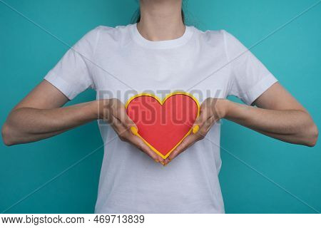 Femalehands Holding And Offering A Heart Shape. Love, Health Concept. Selective Focus.cinematic Effe