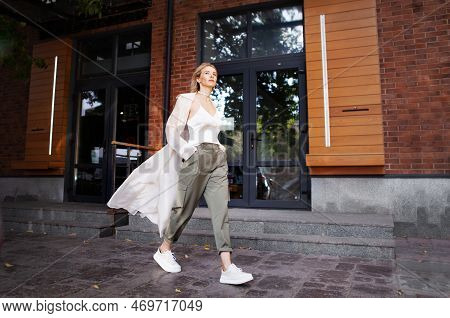 Beautiful Sexy Woman Wearing Fashionable Spring Or Fall Clothes Beige Trench Coat, Oversize Khaki Ca