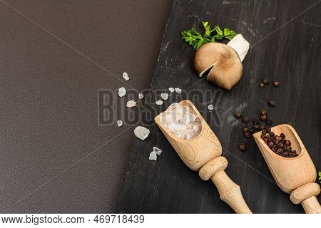 Delicious Organic Oyster Mushrooms With Spices And Fresh Parsley On Wooden Cutting Board