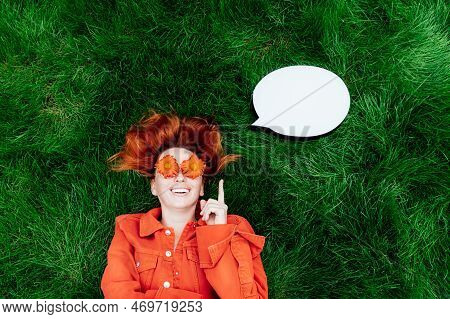 Astonished Positive Smiling Redhead Woman With Red Orange Gerbera Flower Glasses Get Incredible Idea