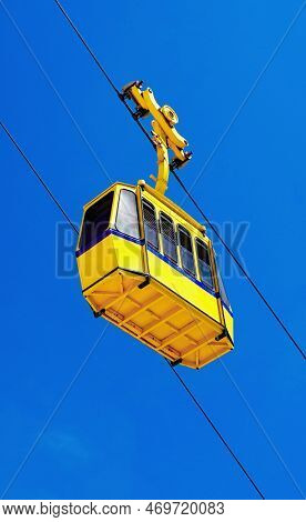 Yellow Cable Funicular Car And Blue Sky