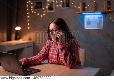 Young Woman Working Or Studying Late At Night In Dormitory With Drawings And Laptop Computer To Comp