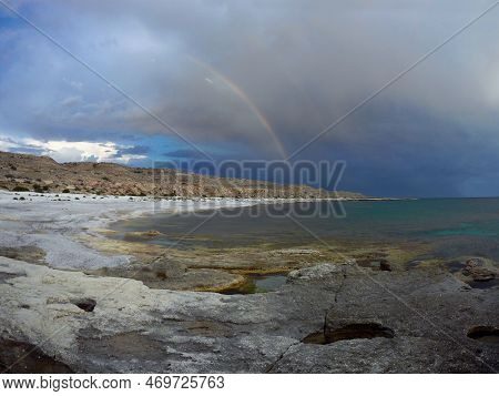 Rainbow Over The Sea. Rocky Coast Of The Caspian Sea. Mangistau Region. Kazakhstan. June Month 2021 