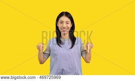Asian Woman Pointing Finger Inviting Click Here, It Is Recommended To Follow This Direction Or Click