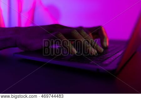 Male Hands Typing On The Notebook Keyboard. African American Man Working On Computer