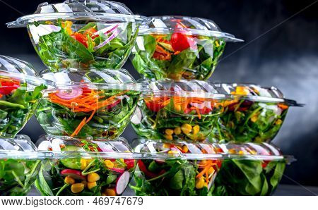 Plastic Boxes With Pre-packaged Vegetable Salads, Put Up For Sale In A Commercial Refrigerator