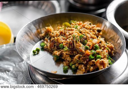 Oats Upama Home Made In The Stainless Steel Plate With Green Peas And Vegitanles Added As A Morning 