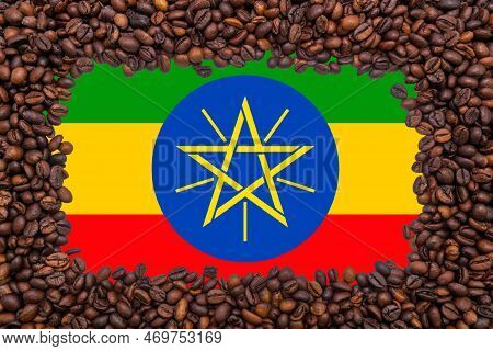 Rectangular Frame Of Roasted Coffee Beans On The Background Of The Flag Of Ethiopia (close-up). The 