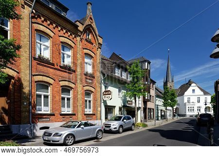 Bedburg, Germany May 11 2022: Main Street Of The Small Town Bedburg With The Church St Lambertus In 