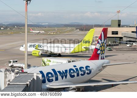 Zurich, Switzerland, January 19, 2023 Air Baltic Bombardier Cs-300 And An Edelweiss Airbus A320-214 