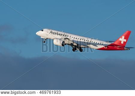Zurich, Switzerland, January 19, 2023 Helvetic Airways Embraer E190-e2 Aircraft Is Departing From Ru