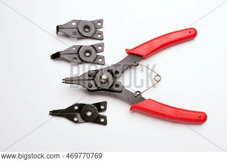 Sideways Snap Ring Pliers Set On A Light Gray Background