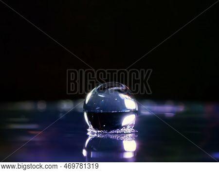 The Moment When The Falling Drop Enters The Liquid. Foreground. Selective Focus.