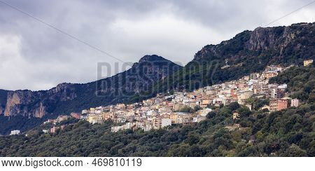 Small Touristic Town, Baunei, In The Mountains Of Sardinia, Italy. Cloudy Rainy Day. Fall Season