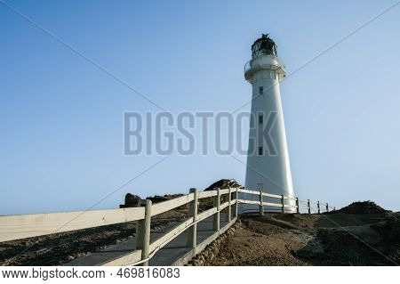 Path And Railing Leading To Castle Point Lighthouse And Coastline On Wairarapa Coast In New Zealand.