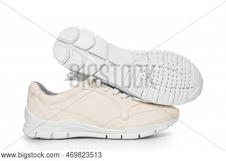 Leather Sneakers With Lacing And Perforated Sole On A White Background.