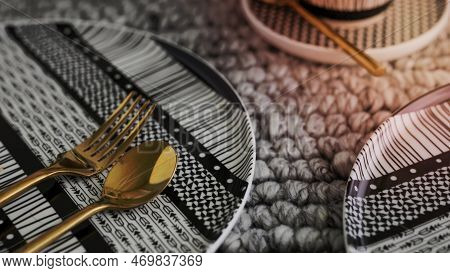 Modern Black Patterned Tableware With Gold Cutlery