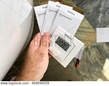 London, United Kingdom - Jan 1, 2022: Close-up Male Hand Holding New Vaillant Vr51 Room Thermostat A