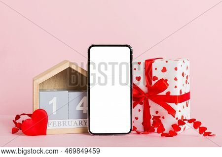Mobile Phone With Blank Screen On Colored Background With Hearts, Calendar And Gift Box, Valentine D