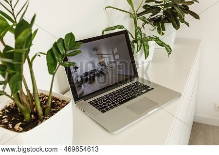 Office Tabletop With Tablet, Laptop Showing Cool Hotel Responsive Design Website