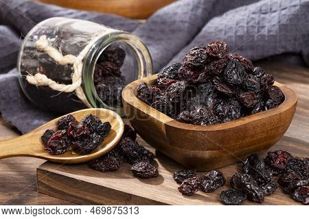 Healthy Food - Nuts Dehydrated Grapes; Photo On Wooden Background