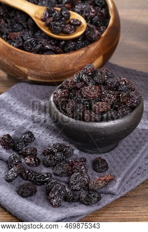 Healthy Food - Nuts Dehydrated Grapes; Photo On Wooden Background