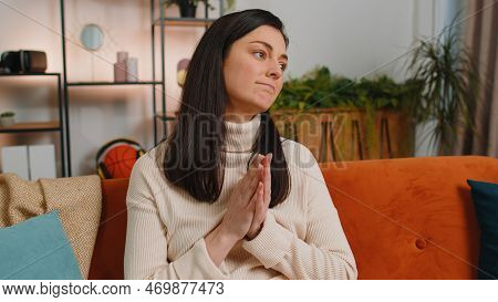 Please, God Help. Woman With Brunette Hair Praying Sincerely With Folded Arms, Looking Upward And Ma