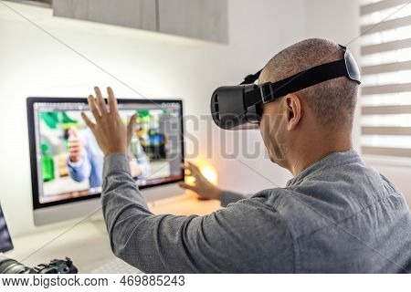 Experience In Virtual Reality. The Industry Of 3d Gaming. A Man Tests A Virtual Reality Set In Lying
