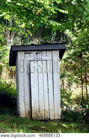 Outhouse For Women Is Wooden And White