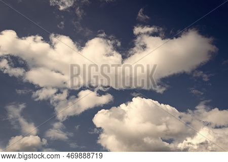 Cloudscape With White Cumulus Tufted Clouds On Cloudy Blue Sky Background
