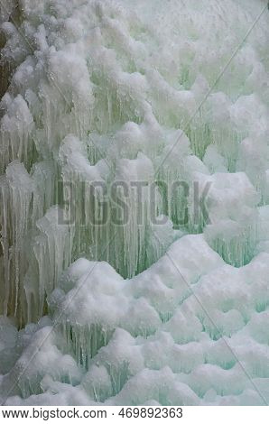 A Close Up Of A Section Of An Icefall Shoe=ws The Inherent Color In The Shadow Areas Of The Ice, Kas
