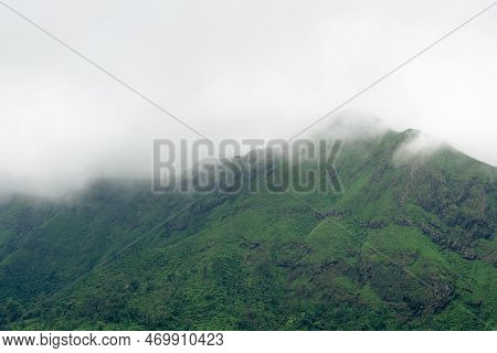 Fog On Top Mountain Landscape Overcast Sky In Rainy Season.