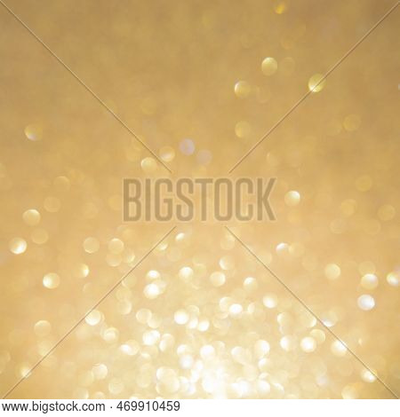 Christmas Golden Glowlight Glitter Blur Bokeh Abstract  Background.concept For Holiday Xmas And Happ